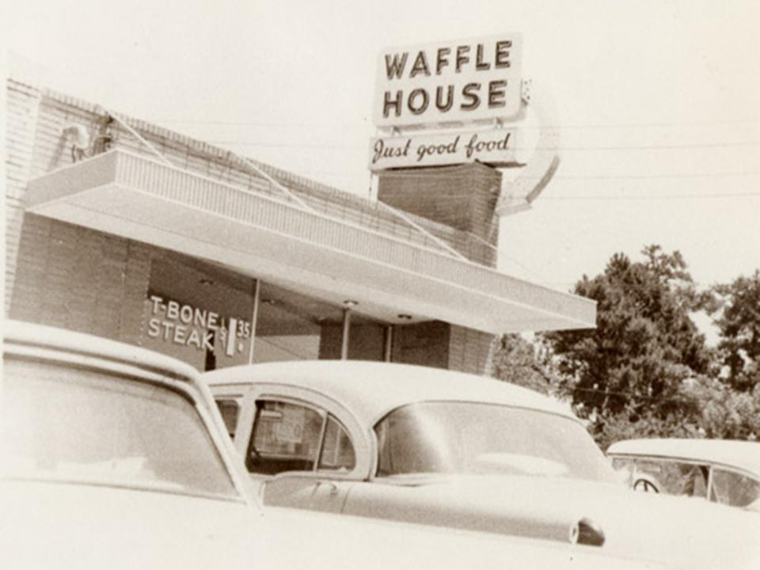 Vintage black and white photo of original Waffle House sign