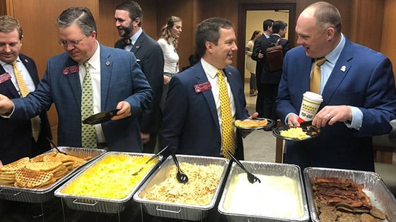 Buffet of Waffle House food at corporate event